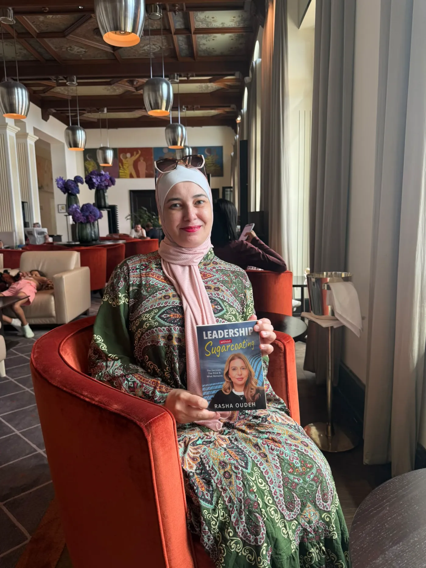 A reader with the book in an elegant hotel lounge