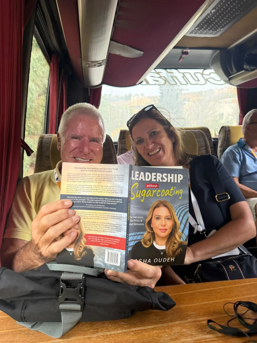 Two readers sharing the book on the road