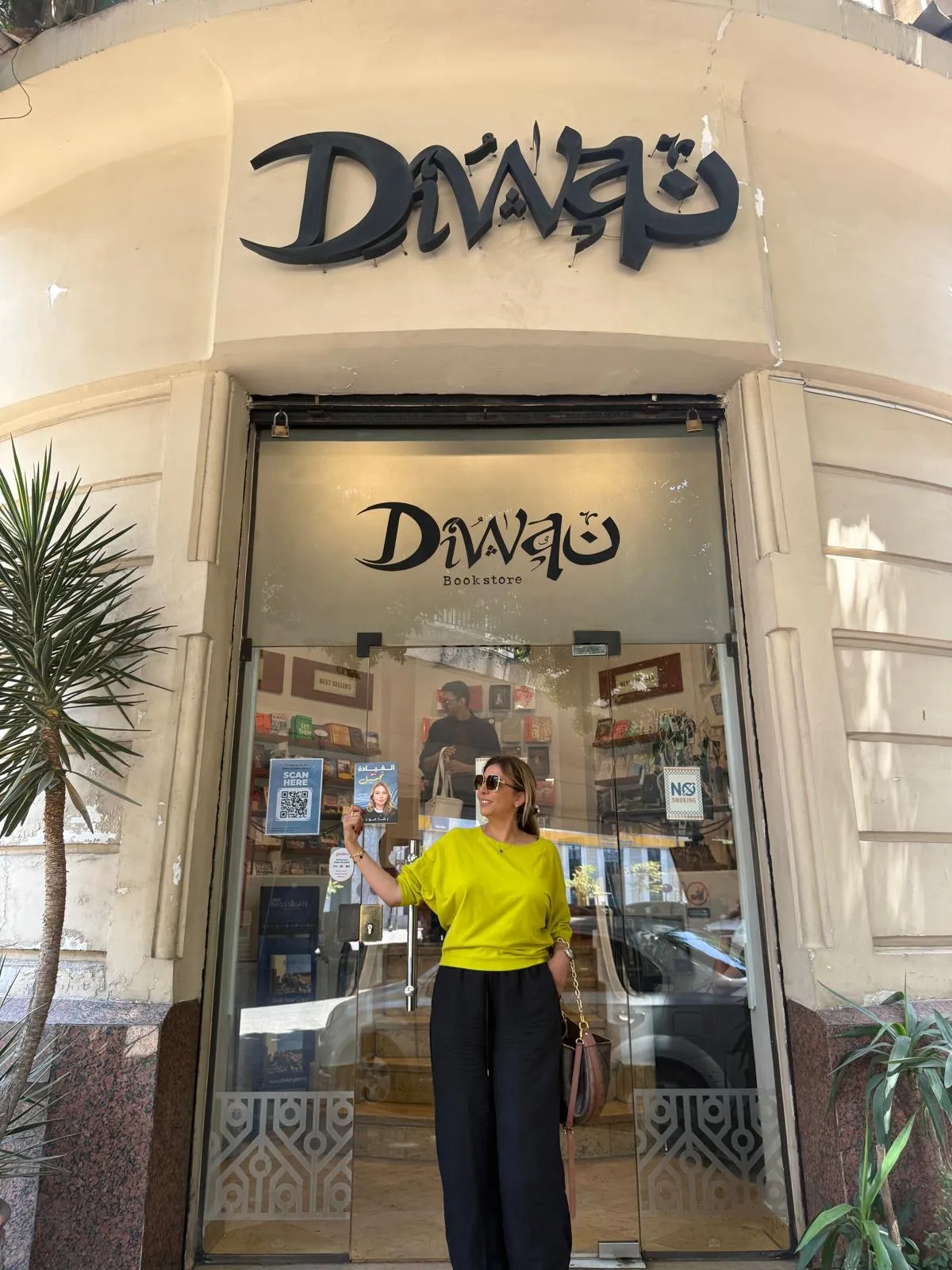 Rasha Oudeh with the Arabic edition outside Diwan Bookstore