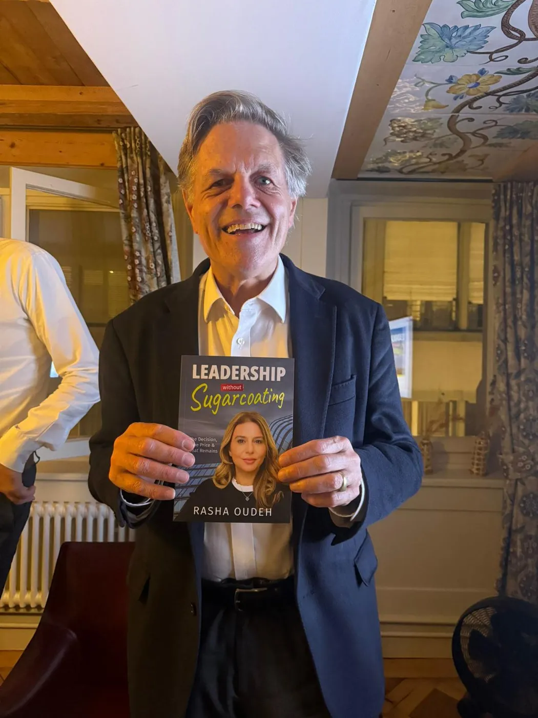 A guest with his signed copy at a book evening